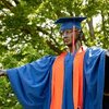 Alma Mater with a cap and gown.